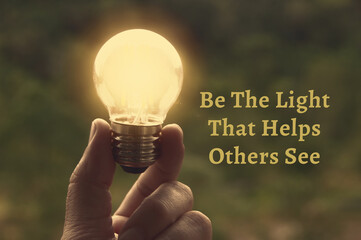 motivational and inspirational quote - be the light that helps others see. with light bulb in vintag