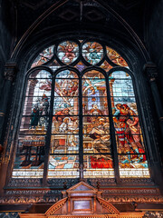 Sticker - Vertical shot of a stained glass window in the Church of Saint Eustache, Paris, France