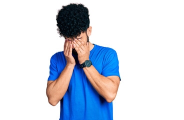 Wall Mural - Young arab man with beard wearing casual blue t shirt rubbing eyes for fatigue and headache, sleepy and tired expression. vision problem