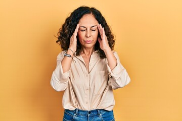 Poster - Middle age hispanic woman wearing casual clothes with hand on head for pain in head because stress. suffering migraine.