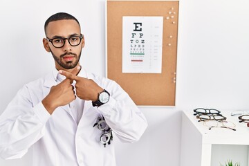 Poster - African american optician man standing by eyesight test rejection expression crossing fingers doing negative sign