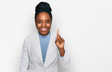 Poster - Young african american woman wearing business clothes pointing finger up with successful idea. exited and happy. number one.