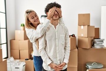 Poster - Girl surprising his boyfriend covering eyes at new home.