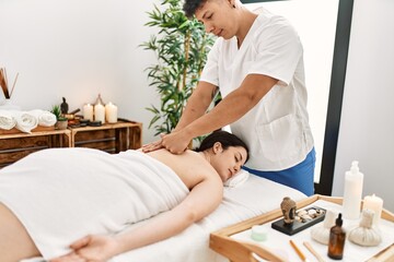 Wall Mural - Woman reciving back massage at the clinic.