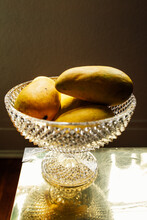 Yellow Champagne Mango Fruit In Crystal Bowl