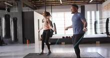 Video Of Fit Diverse Woman And Man Jumping On Jumping Rope At Gym