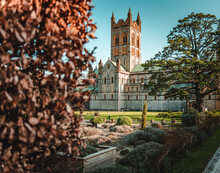 The Exterior Of Buckfast Abbey Covered By Bush At The Front