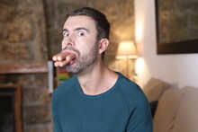 Man Eating A Bunch Of Sausages At Once