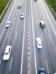 Poster - Aerial drone photograph of traffic jam on a multi lane highway with motion blur effect.