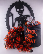Halloween Fun For Kids With Spooky Skeleton With Trick Or Treat Candy Bag In Orange And Black Tinsel