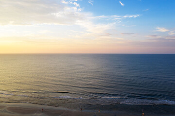 Wall Mural - Aerial view of sunset at sea, waves and beach on Hilton Head Island, South Carolina