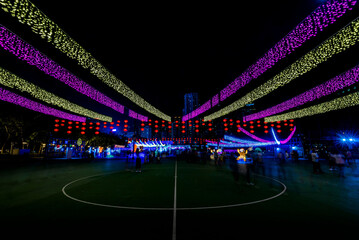 Wall Mural - Night shot of LED illuminated decoration in an amusement park