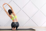 Fototapeta  - Young woman training in gym. Concept of healthy spine