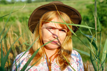 Defocus Closeup Outside Portrait Of Beautiful Young Blonde Woman On Nature Background. Plant Art Shadows. Cowgirl On Meadow. Mental Health, Silence. Countryside. Out Of Focus