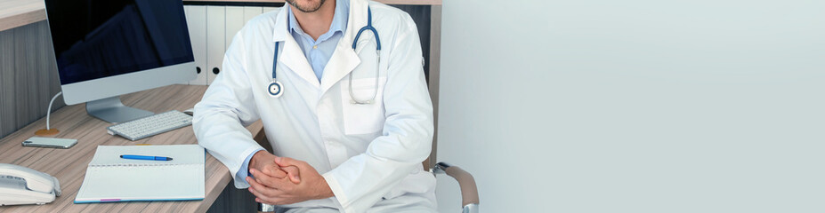 Doctor in uniform at workplace in clinic, space for text. Banner design