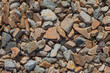 The texture of the stone. Brown and gray gravel is used for mulching the soil