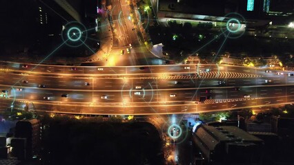 Wall Mural - aerial view of smart city and smart traffic on road intersection in hangzhou at night
