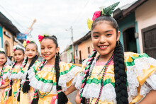 Group Of Girls In Folkloric Costume On A Street In Leon
