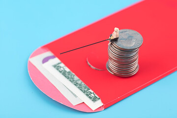 Fisherman catches money in red envelope on coins