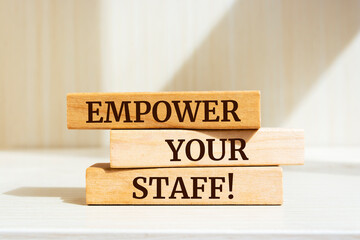 Poster - Wooden blocks with words 'Empower your staff'.