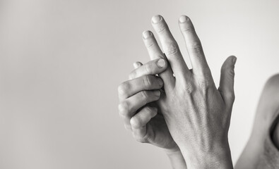 Closeup of woman with sore finger joint hand