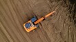 Aerial view of the excavator. The excavator prepares the road from sand for laying asphalt.