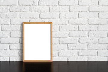 Wall Mural - Blank picture frame against brick wall with copy space