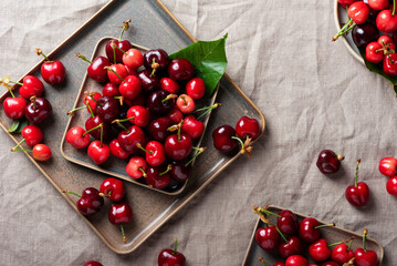 Wall Mural - Fresh sweet cherry with green leaves