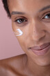 © Connect Images - Close-up of smiling woman with cream on face