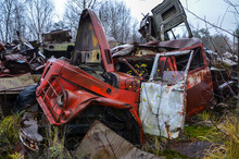 Old Rusty Broken And Damaged Abandoned Soviet Fire Truck On Scrap Metal Recycling Yard. Rusty Scrap Metal And Recycled Waste.