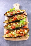 Fototapeta Kawa jest smaczna - baked eggplant with vegetables on wooden board