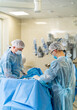 © Vadim - Modern surgery medical healthcare. Doctors operating in hospital ward.