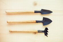 Gardener Tool On Wooden Background. Gardener's Tools: Shovels And Rake.