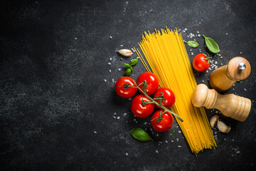 Wall Mural - Pasta, olive oil, spices, basil and fresh tomatoes.