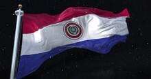Paraguay Flag Waving With Rain And Snow In The Night. Loop