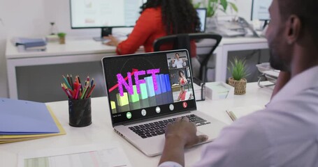 Wall Mural - Video of african american man having nft video call on laptop with coworkers