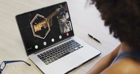 Wall Mural - Video of african american woman having nft video call on laptop with diverse coworkers