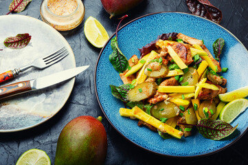 Wall Mural - Light salad with chicken, mango and herbs.