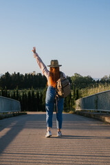 Wall Mural - Traveler girl with backpack