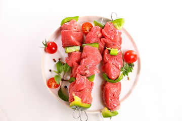 Poster - raw barbecue beef skewers on plate