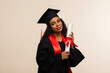 African american woman in graduate dress and mortarboard