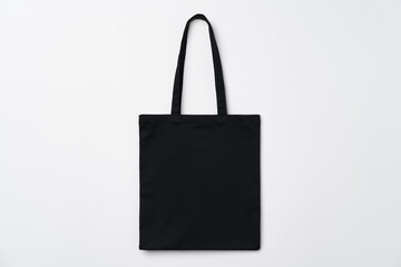 Wall Mural - Empty fabric shopping bag on white background