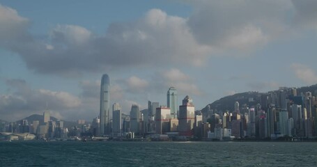 Fototapete - Take ferry cross the Hong Kong Victoria harbor