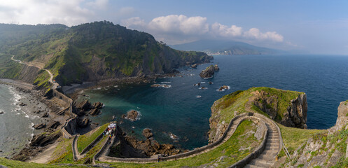 Canvas Print - long and winding stone stairs leading up to the Church of San Juan de Gaztelugatxe with a view of the coast of the Spanish Basque Country