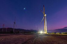 Wind Turbine Tower Installation With A Crane To Generate Alternative Power - Green Energy Concept To Reduce Global Warming And Climate Change