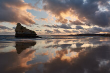 Symmetrical Reflection Of The Landscape In Low Tide Water. Atlantic Ocean, Portugal