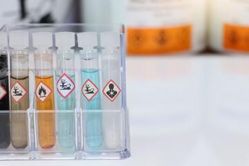 Chemicals in test tubes and symbols used in laboratory