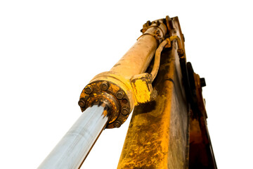 Canvas Print - Hydraulic cylinder of yellow Backhoe in factory