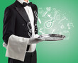 © ra2 studio - Waiter holding silver tray with food icons above