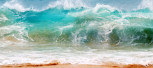 Blue And Aquamarine Color Sea Waves And Yellow Sand  With White Foam. Marine Beach Background. Banner Format.